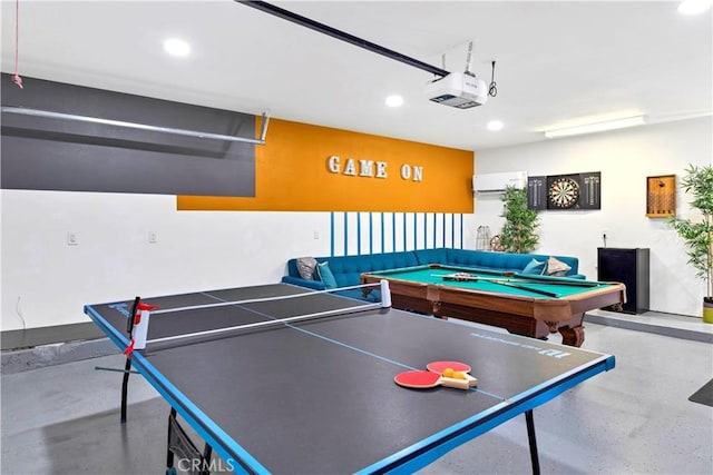 recreation room with a garage, concrete flooring, and recessed lighting