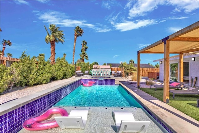 view of pool with fence private yard, a pool with connected hot tub, and a patio