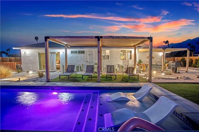 view of pool with a patio, fence, and a fenced in pool