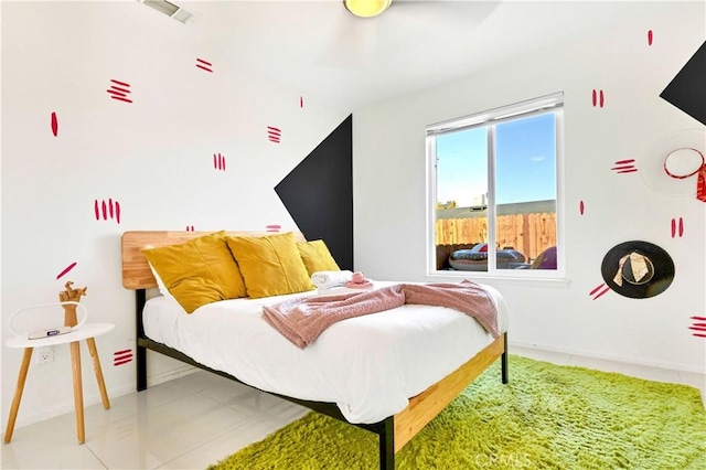 bedroom with visible vents and baseboards