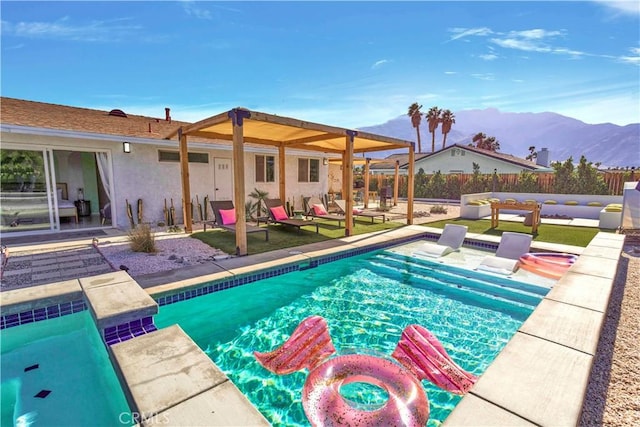 view of swimming pool featuring a fenced in pool, a patio area, a mountain view, and fence