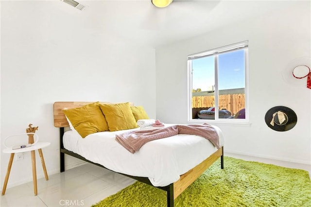 bedroom featuring visible vents and baseboards