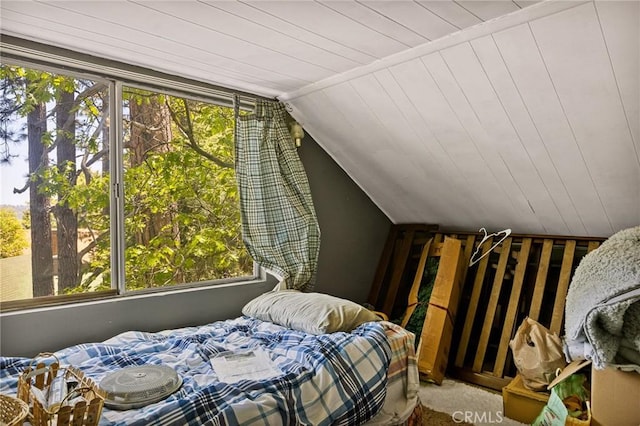 bedroom with multiple windows, lofted ceiling, and wood ceiling