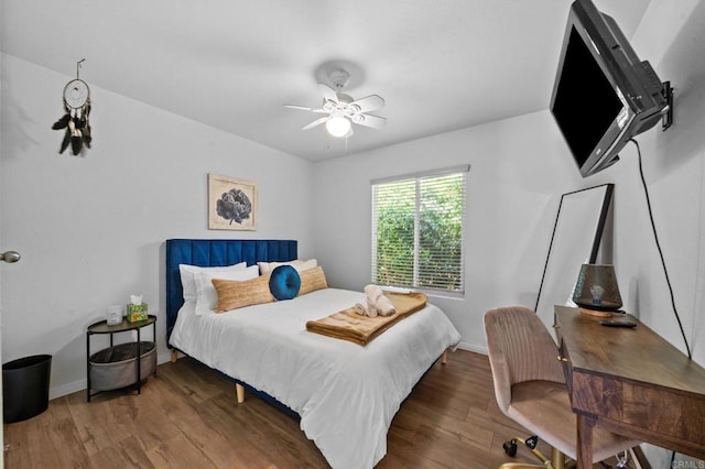 bedroom with dark wood-type flooring and ceiling fan