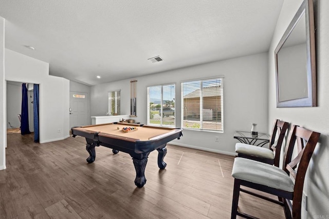 game room featuring pool table, lofted ceiling, and light wood-type flooring