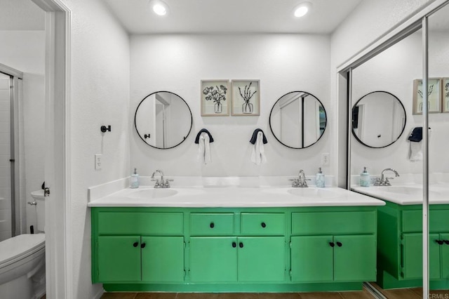 bathroom with vanity, toilet, and tile patterned flooring