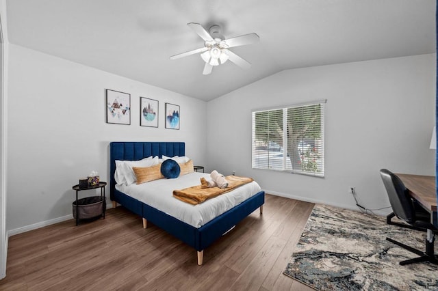 bedroom featuring ceiling fan, vaulted ceiling, and dark hardwood / wood-style floors