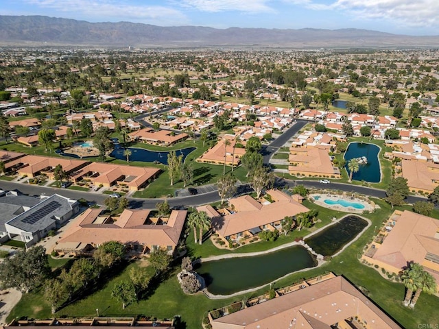 bird's eye view with a water and mountain view