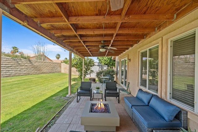 view of patio / terrace featuring an outdoor living space with a fire pit and ceiling fan