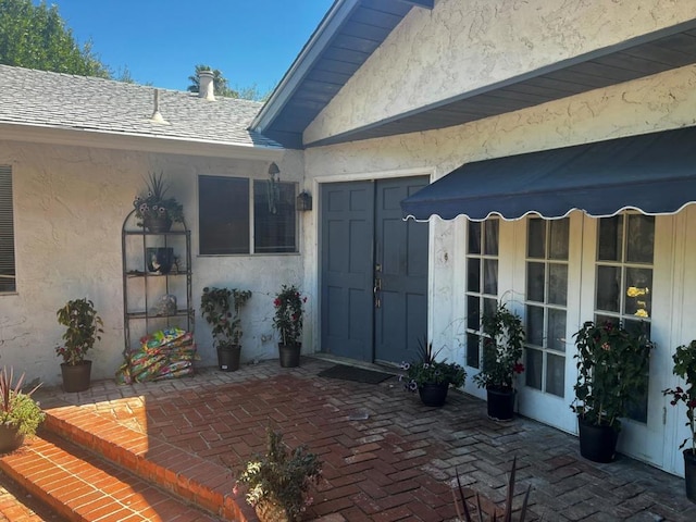 doorway to property with a patio