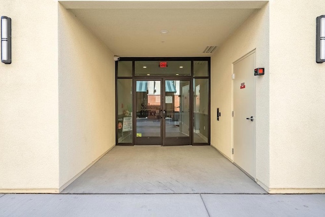 doorway to property featuring french doors