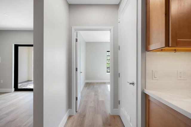 hallway featuring light hardwood / wood-style flooring