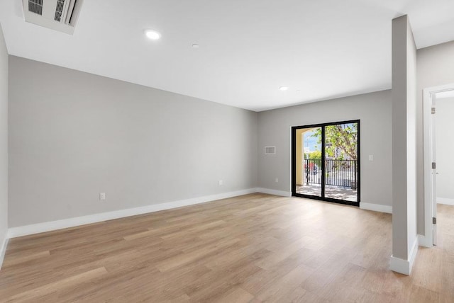 empty room with light hardwood / wood-style floors