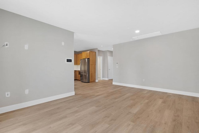 unfurnished living room featuring light hardwood / wood-style floors