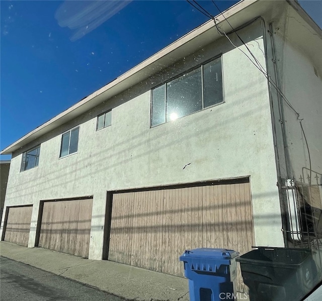 view of property exterior with a garage