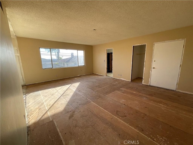 empty room featuring a textured ceiling