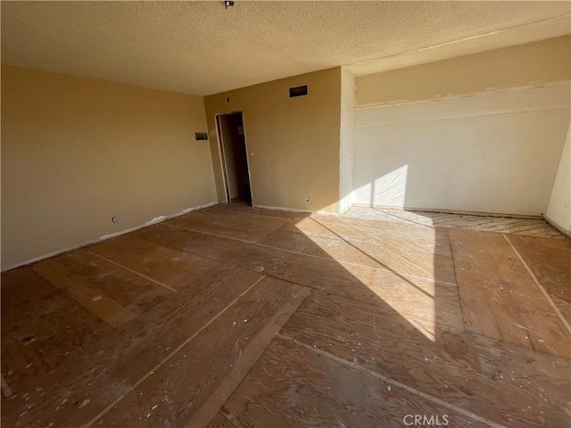 empty room with a textured ceiling