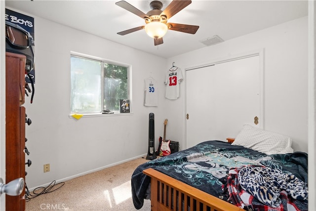 bedroom featuring carpet, a closet, and ceiling fan