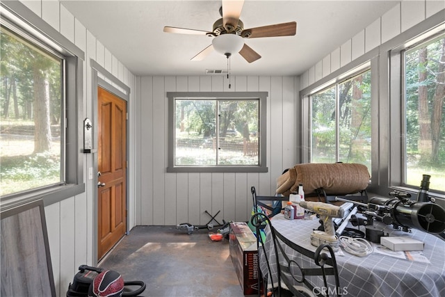 sunroom with a wealth of natural light and ceiling fan