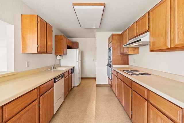 kitchen featuring sink and white appliances