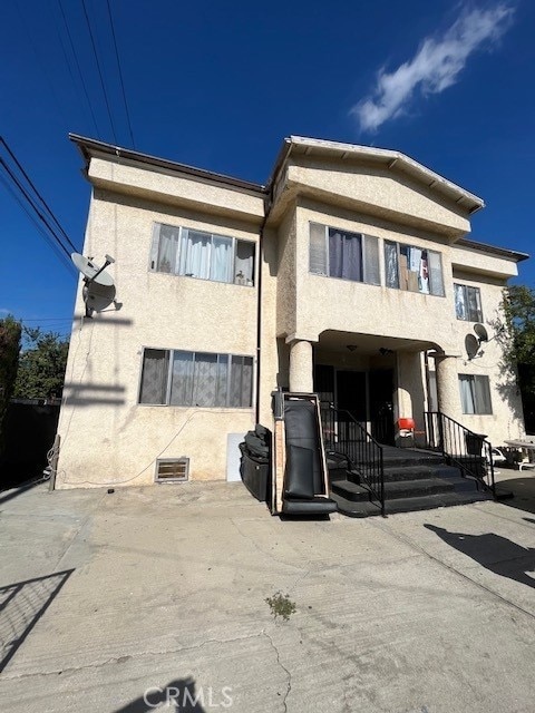 back of house with stucco siding