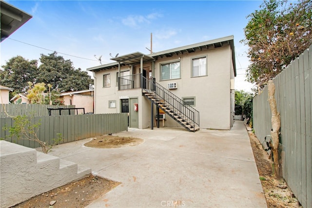 back of property featuring a patio area