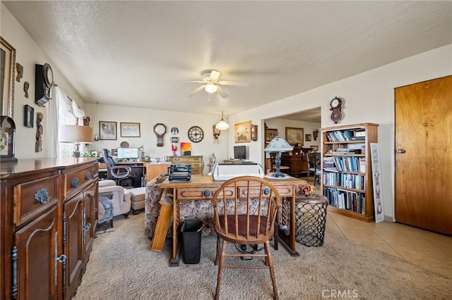 tiled dining room with ceiling fan