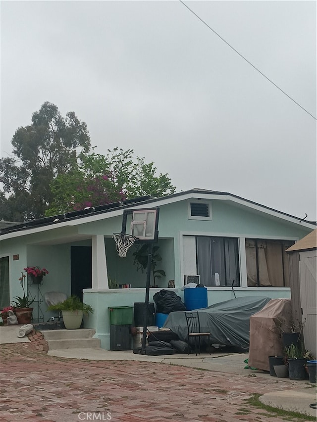 rear view of house featuring a patio