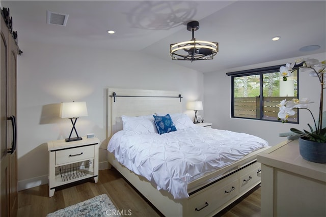 bedroom featuring dark wood-type flooring and vaulted ceiling