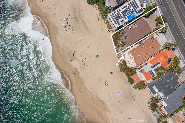 bird's eye view with a water view and a view of the beach