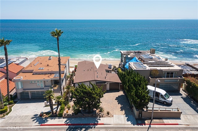 aerial view with a water view and a beach view