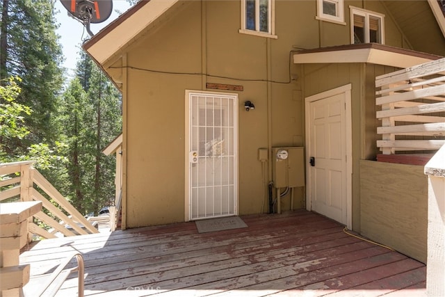 view of exterior entry featuring a deck