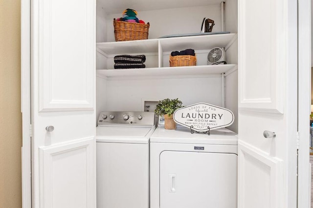 clothes washing area featuring washing machine and clothes dryer