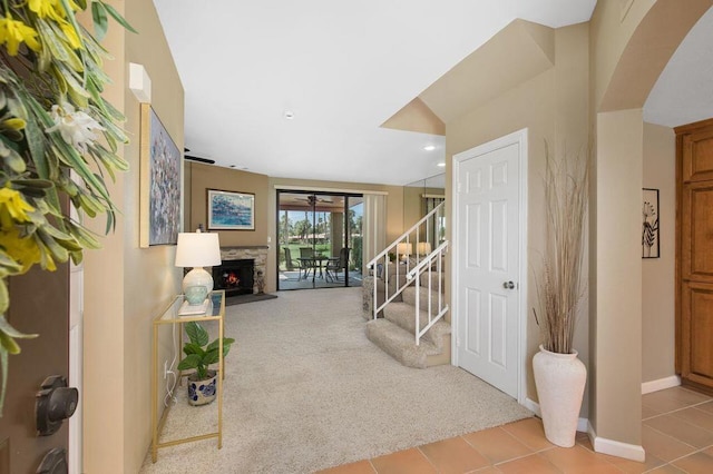 hallway featuring light carpet