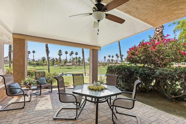 view of patio featuring ceiling fan