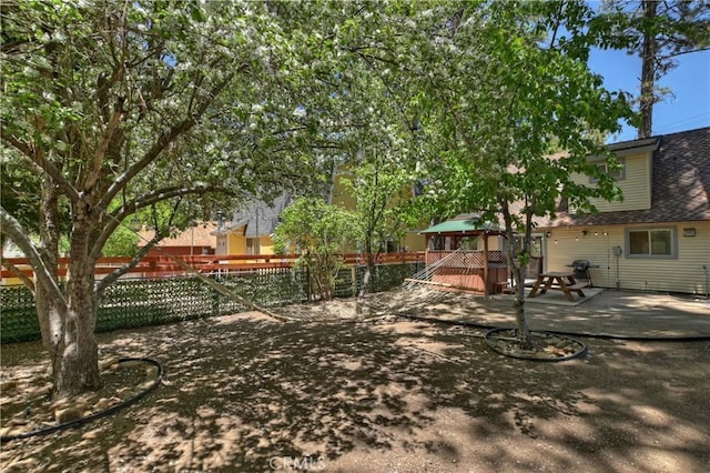 view of yard featuring a wooden deck