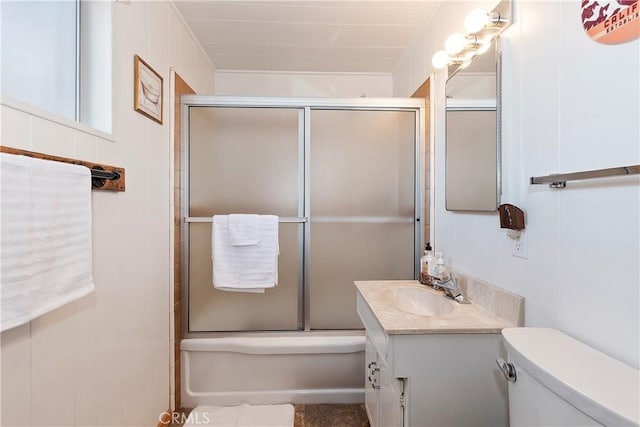 bathroom featuring walk in shower, vanity, and toilet