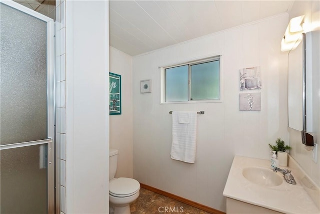 bathroom with vanity, toilet, an enclosed shower, and crown molding