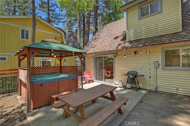 exterior space with a gazebo, area for grilling, a patio, and a hot tub