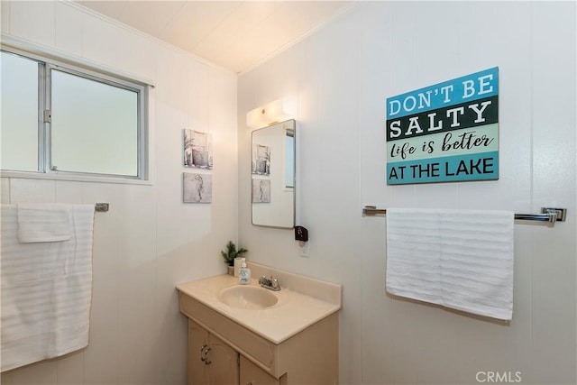 bathroom featuring vanity and ornamental molding