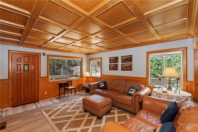 living room featuring beamed ceiling, wooden ceiling, coffered ceiling, and light hardwood / wood-style floors