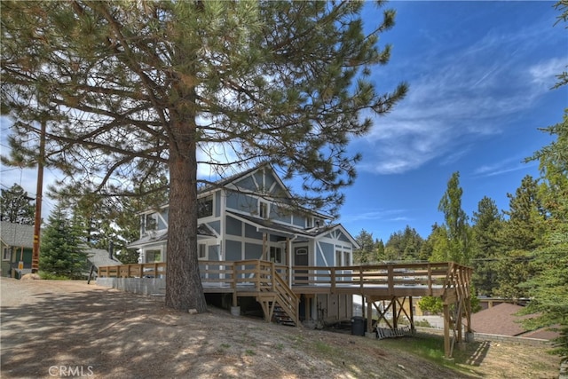 rear view of house with a wooden deck