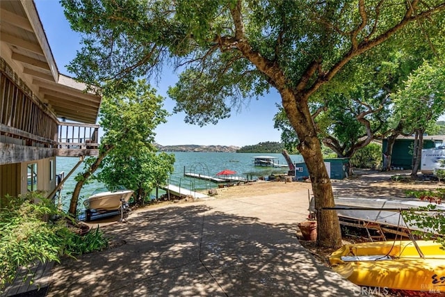 property view of water with a dock