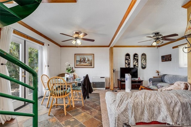 living room featuring ceiling fan, crown molding, beamed ceiling, and a textured ceiling