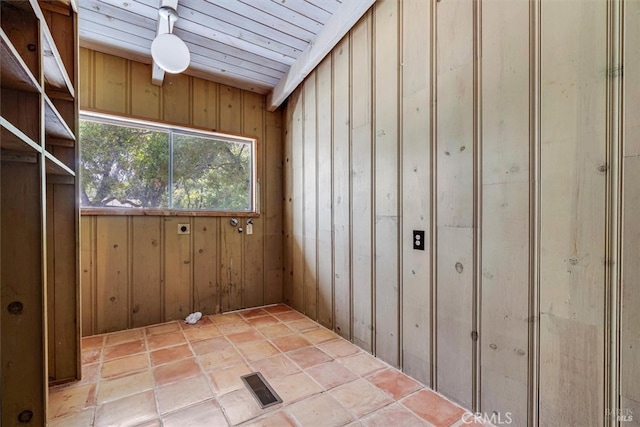 laundry room featuring wooden walls