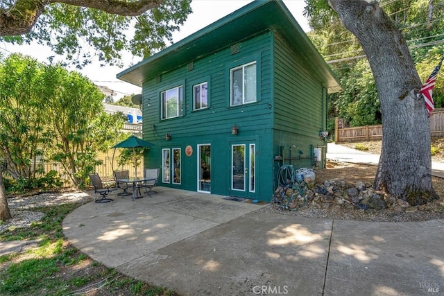 rear view of house featuring a patio