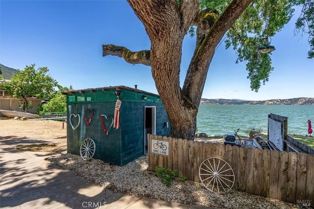 exterior space featuring a water and mountain view