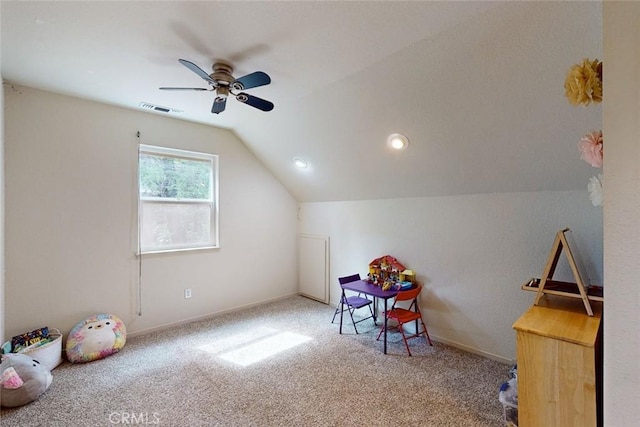 recreation room with ceiling fan, carpet, and vaulted ceiling