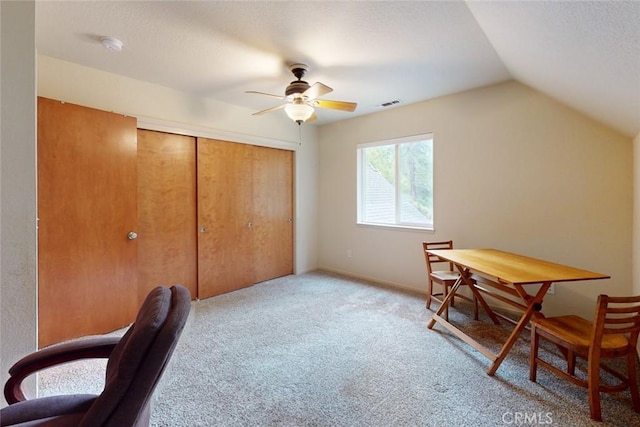 home office with ceiling fan, lofted ceiling, and light carpet