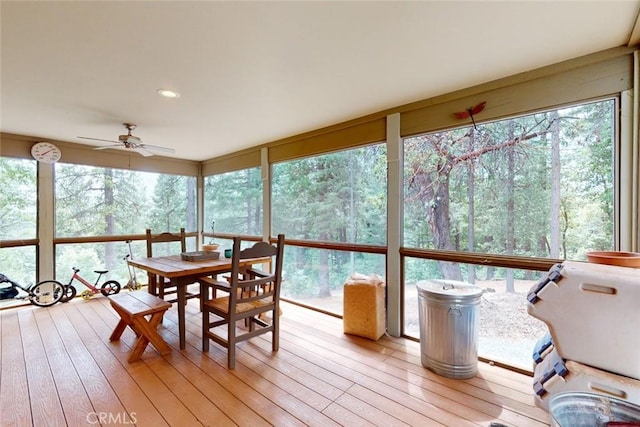 sunroom featuring ceiling fan